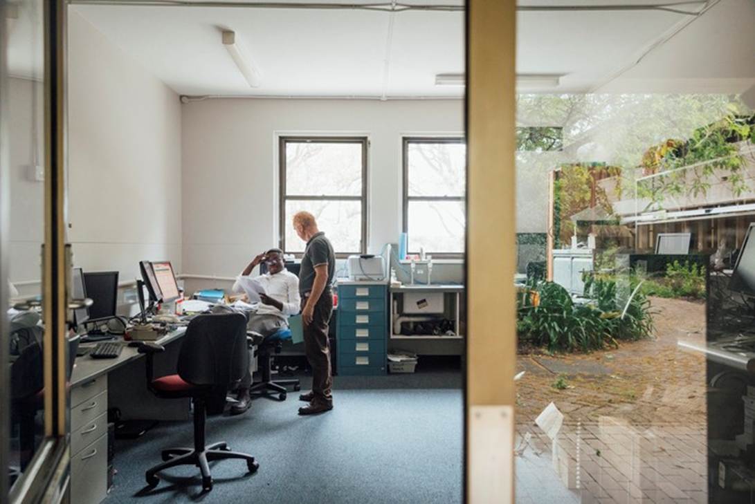 A person standing in an office
AI-generated content may be incorrect.